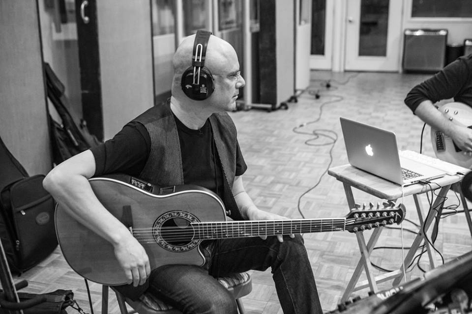 Tony Geballe with a 12-string guitar at a recording session
